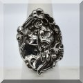 J047. Sterling embossed ring with woman's face. Size 6 - $85 